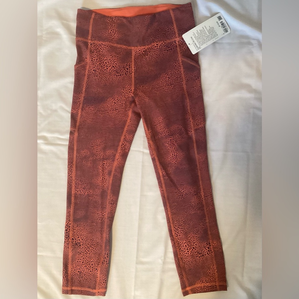 LULULEMON Size 8 Orange Black Crop Leggings Pockets